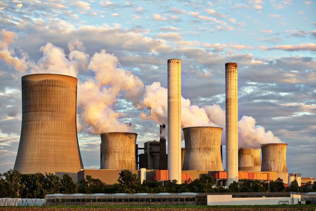 Power plant with cooling towers and smokestacks representing European energy infrastructure