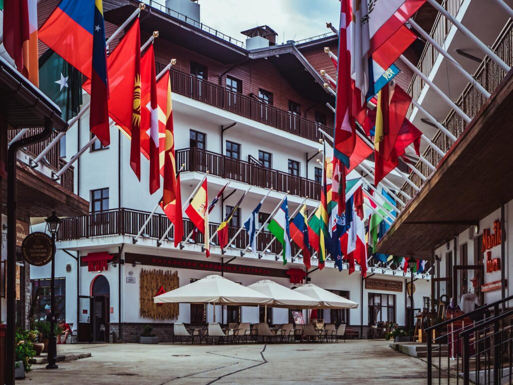 National flags of European countries displayed at a European building, symbolizing sovereignty and national identity