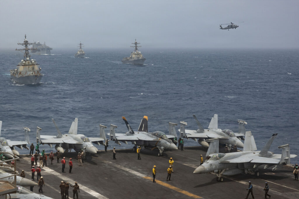 U.S. Navy warships and aircraft transit the Arabian Sea