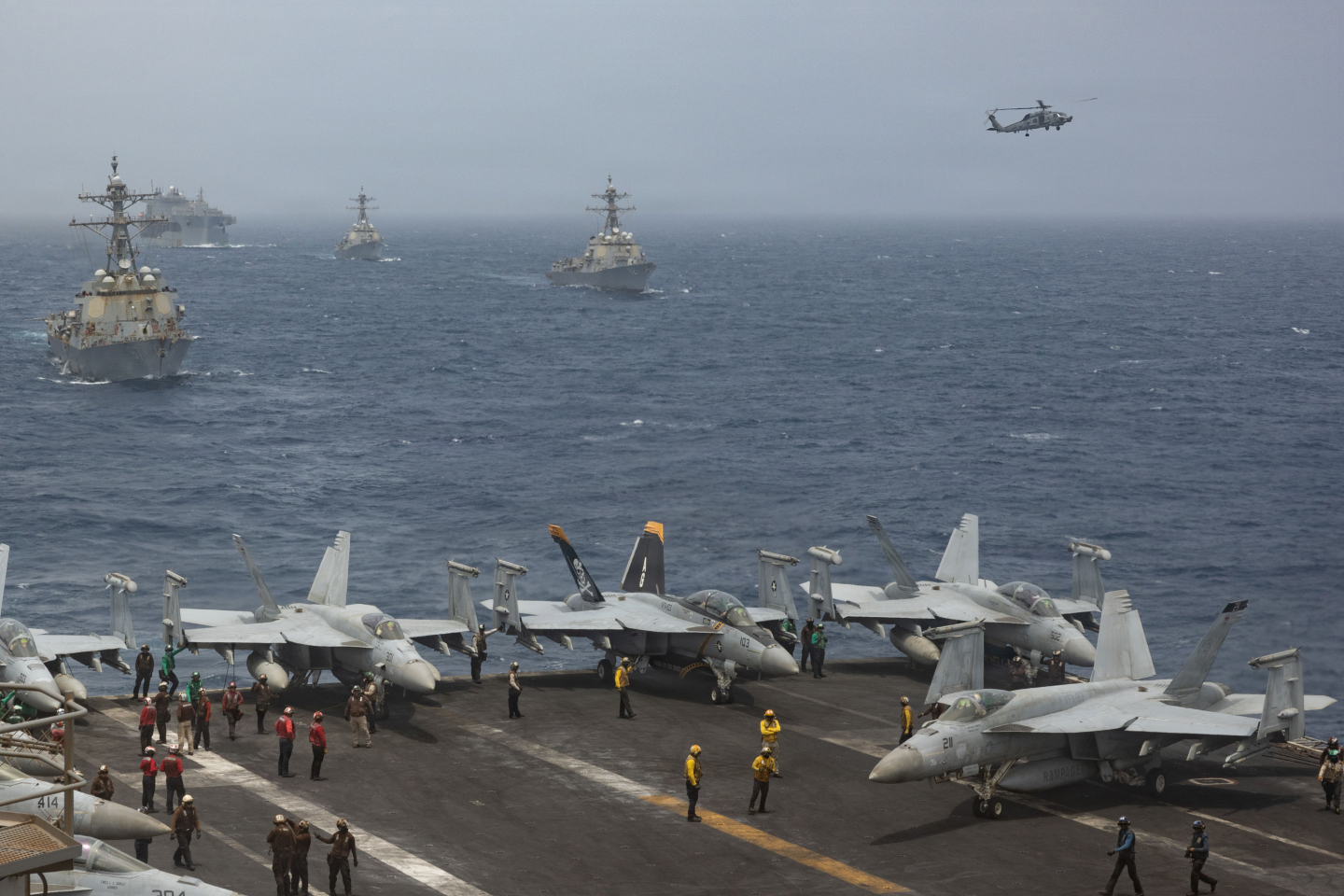 U.S. Navy warships and aircraft transit the Arabian Sea
