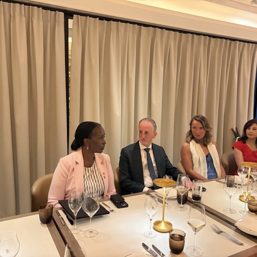 Ambassador Robie Kakonge speaks with guests during the Gold Institute dinner