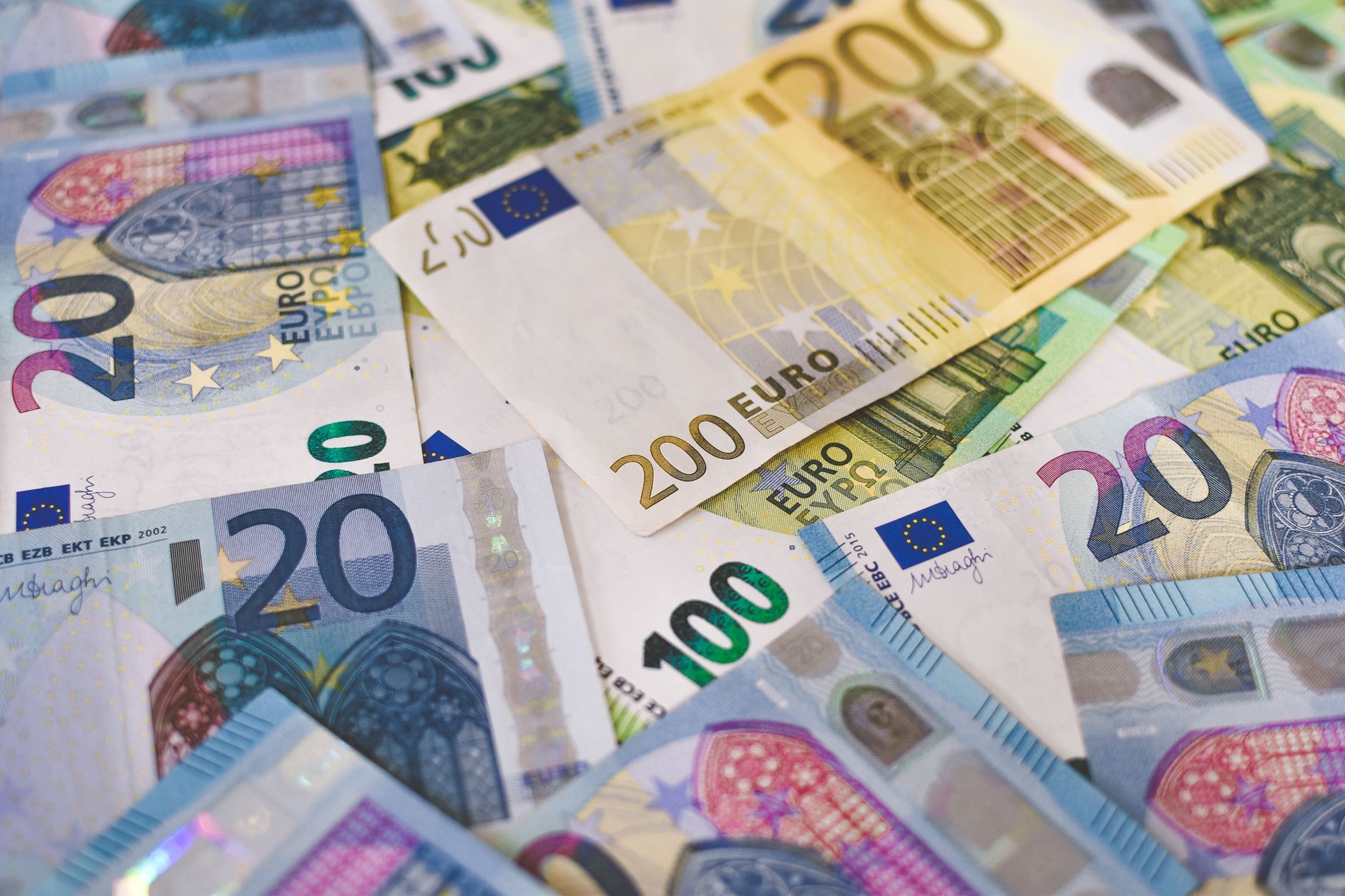 Euro banknotes scattered on a surface