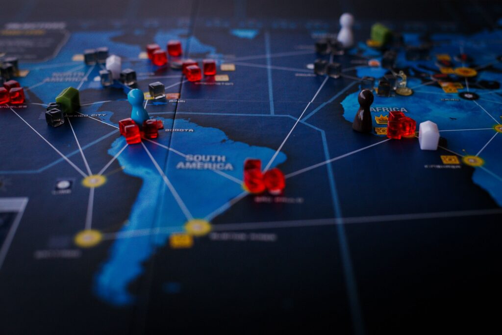 Strategy pieces connected across a world map, representing alliance networks