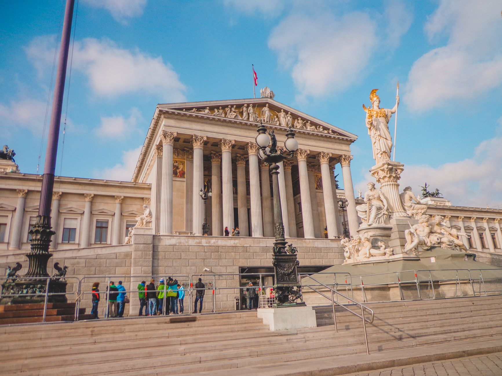 Exterior view of the Vienna Parliament Building with the Athena Fountain