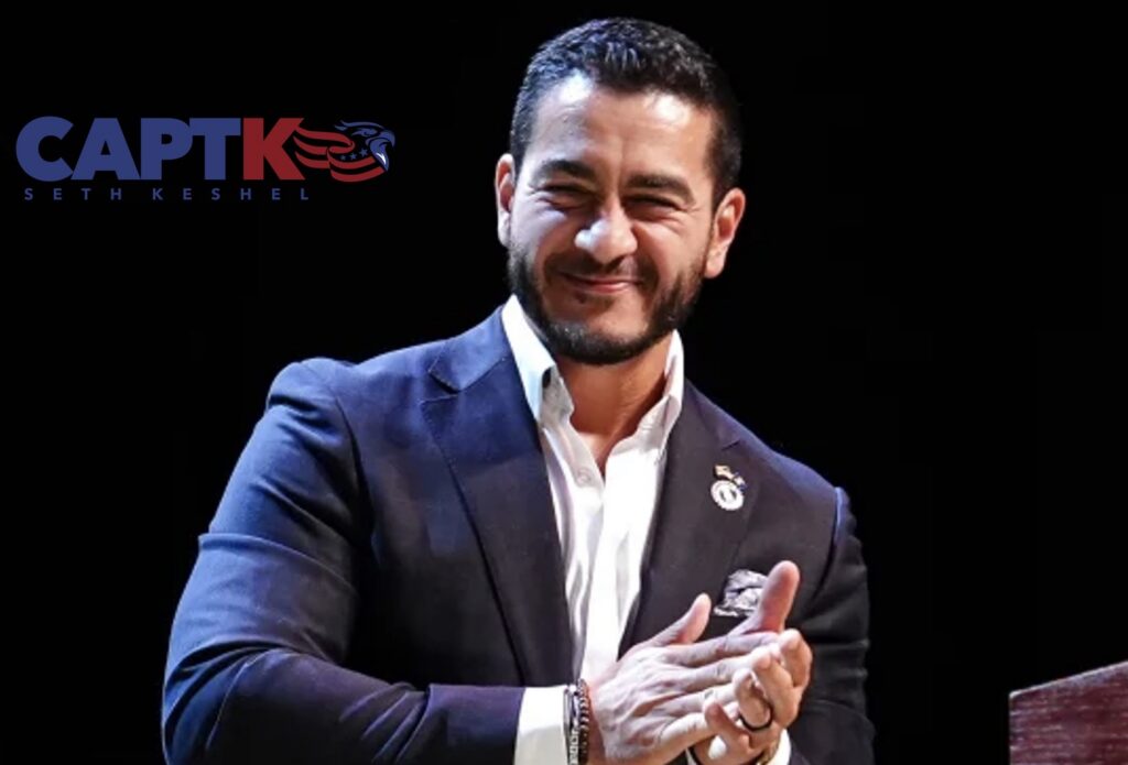 Michigan Democratic U.S. Senate nominee Abdul El-Sayed applauding on stage
