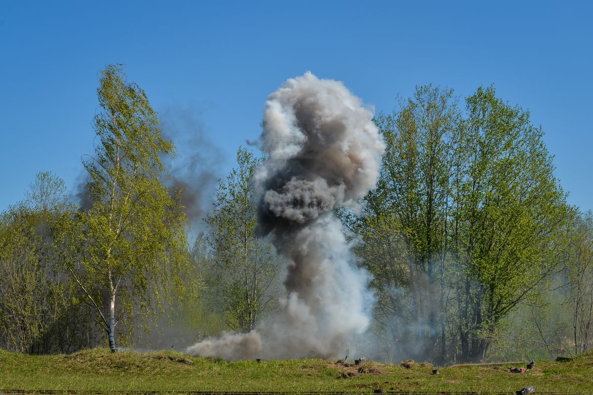 A powerful explosion creating a large cloud of smoke