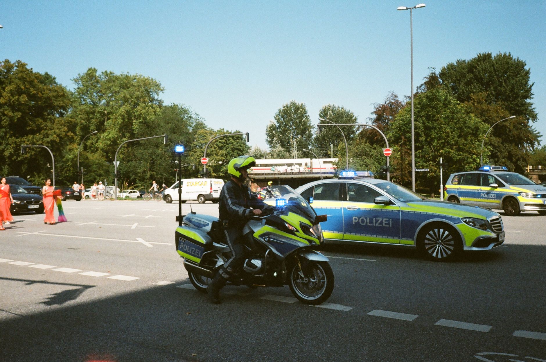 German police vehicles and officers on a city street