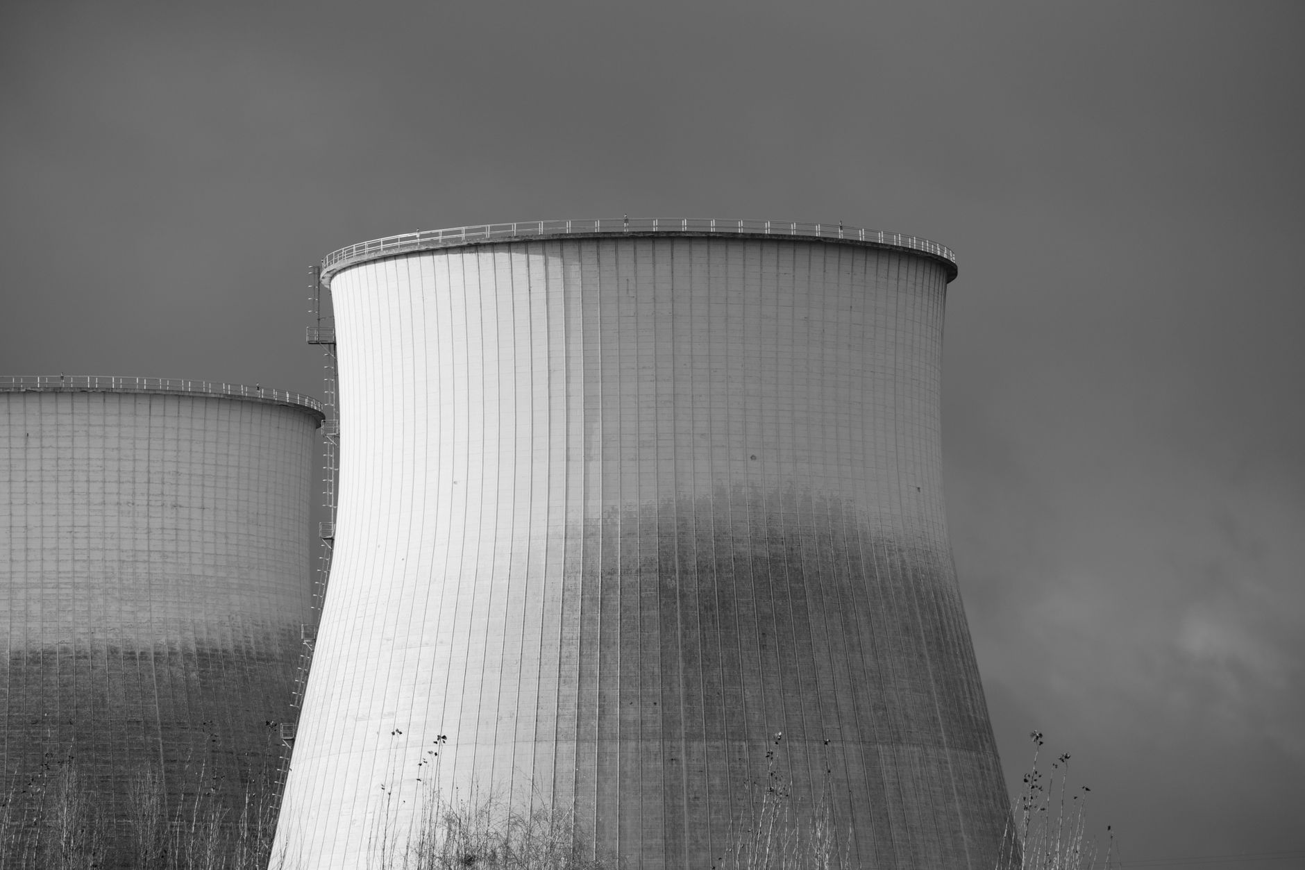 Cooling towers at a nuclear power station in black and white
