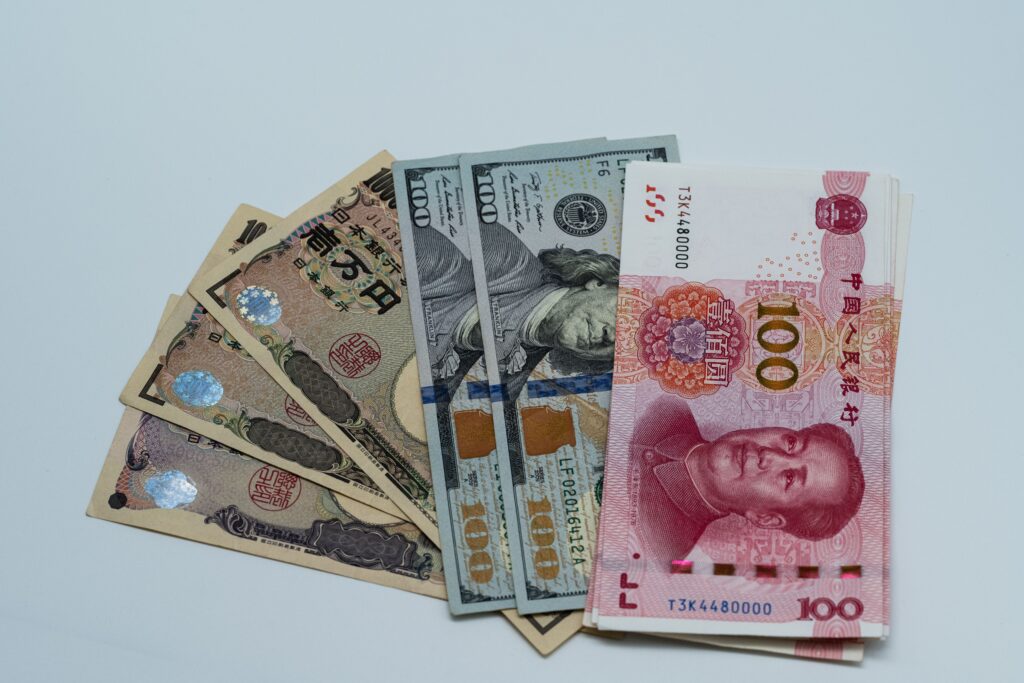 Banknotes from several countries, including U.S. dollars, Japanese yen and Chinese yuan, laid side by side