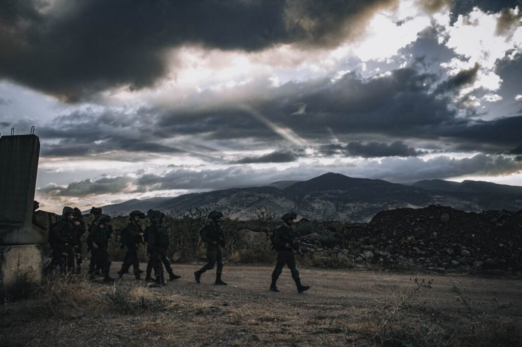 Soldiers marching through a rugged landscape in Israel