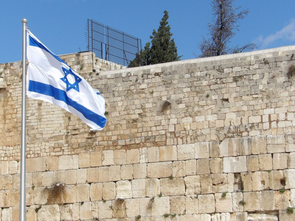 Israeli flag waving at the Western Wall in Jerusalem