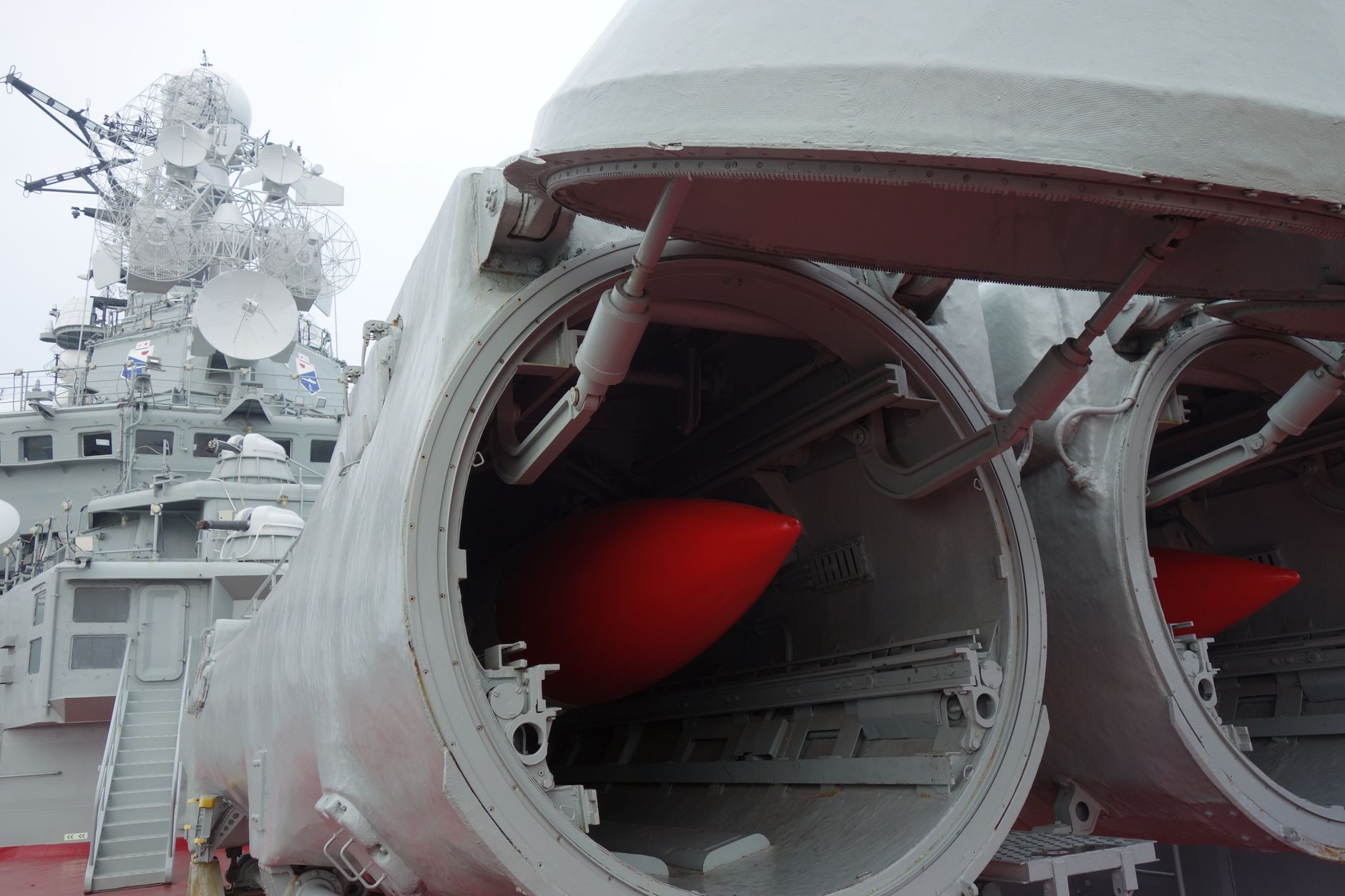 A naval warship's open missile launcher bays. Photo by mingche lee on Pexels
