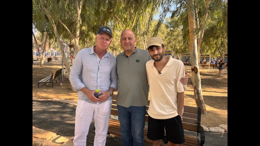 Rob Roos at the site of the Nova music festival with survivor Shalev Biton